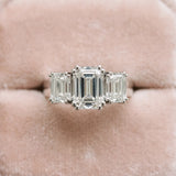 14K White Gold Three-Stone 3.09 Carat D VVS1 Round Cut Diamond Ring with Channel Set Band and Four-Prong Setting