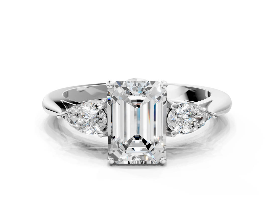 White gold Three-Stone Emerald Cut Diamond Ring with Pear Side Stones in Four-Prong Setting_217