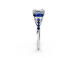 White gold Three-Stone Emerald Cut Diamond Ring with Round with Blue Sapphire side stone Pavé Band and Prong Setting_14