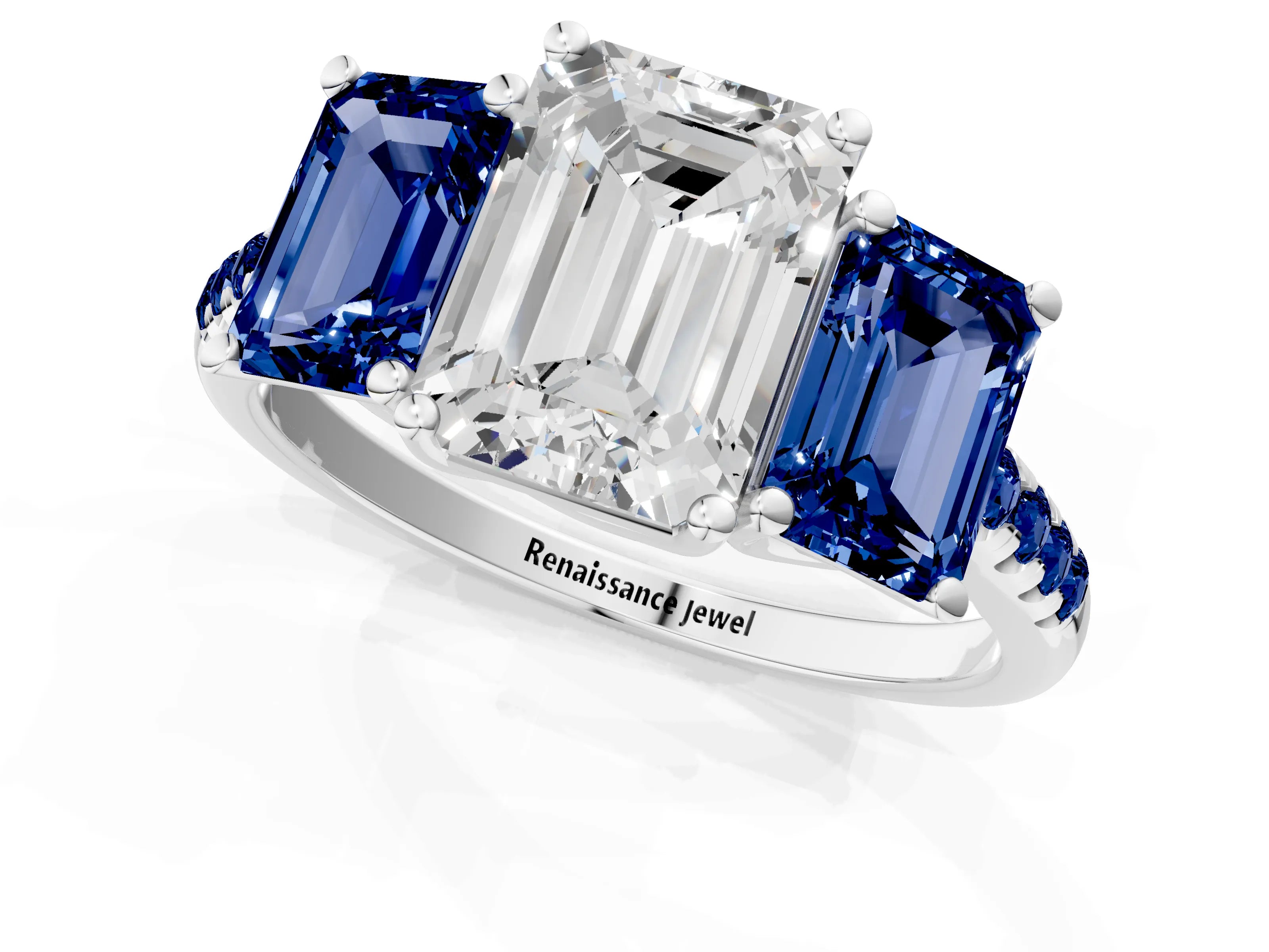 White gold Three-Stone Emerald Cut Diamond Ring with Round with Blue Sapphire side stone Pavé Band and Prong Setting_1