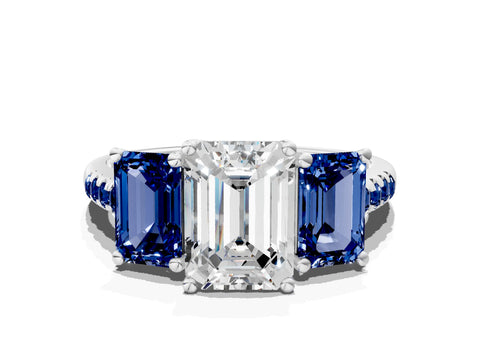 White gold Three-Stone Emerald Cut Diamond Ring with Round with Blue Sapphire side stone Pavé Band and Prong Setting