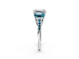 White gold Three-Stone Emerald Cut Diamond Ring with Round with Blue Topaz side stone Pavé Band and Prong Setting_2