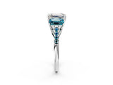 White gold Three-Stone Emerald Cut Diamond Ring with Round with Blue Topaz side stone Pavé Band and Prong Setting_38