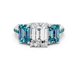 White gold Three-Stone Emerald Cut Diamond Ring with Round with Blue Topaz side stone Pavé Band and Prong Setting