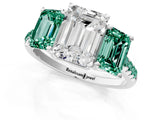 White gold Three-Stone Emerald Cut Diamond Ring with Round with Green Sapphire side stone Pavé Band and Prong Setting_1
