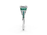 White gold Three-Stone Emerald Cut Diamond Ring with Round with Green Sapphire side stone Pavé Band and Prong Setting_2