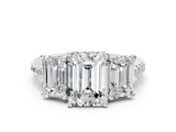 White gold Three-Stone Emerald Cut Diamond Ring with Round with Moissanite side stone Pavé Band and Prong Setting