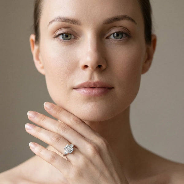 White gold Three-Stone Emerald Cut Diamond Solitaire with Prong Setting and Classic Band