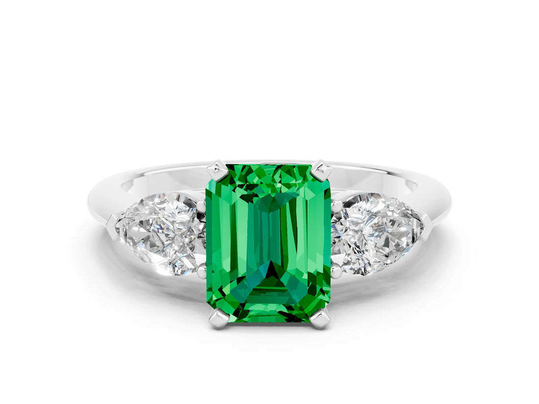 White gold Three-Stone Emerald Cut Emerald Ring with Pear Side Stones and Four-Prong Setting