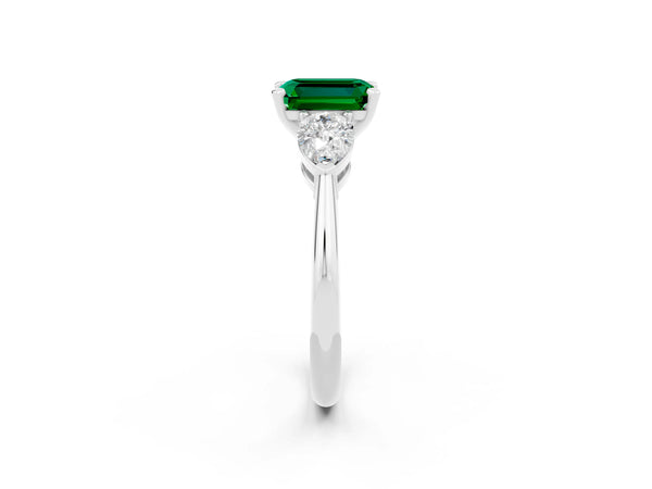 Platinum Three-Stone Emerald Cut Emerald Ring with Pear Side Stones and Four-Prong Setting