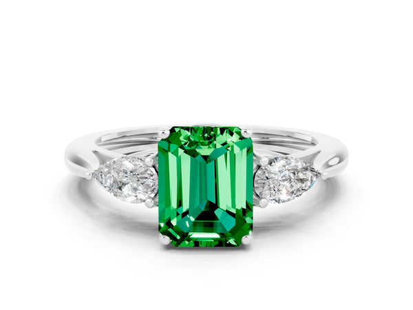 Platinum Three-Stone Emerald Cut Emerald Ring with Pear  Side Stones in Four-Prong Setting