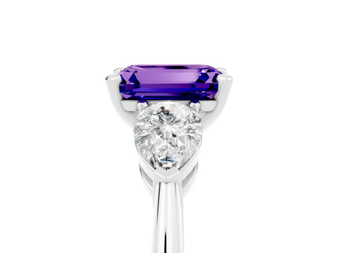 White gold Three-Stone Emerald Cut Tanzanite Ring with Pear Side Stones and Four-Prong Setting_5