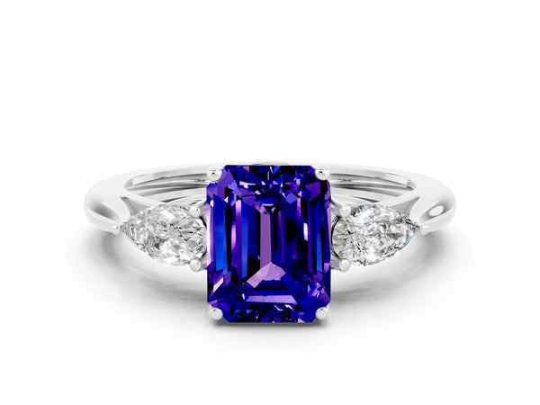 Platinum Three-Stone Emerald Cut Tanzanite Ring with Pear  Side Stones in Four-Prong Setting