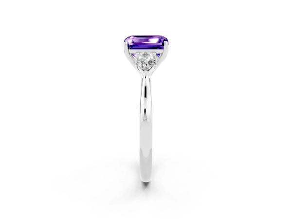 Platinum Three-Stone Emerald Cut Tanzanite Ring with Pear  Side Stones in Four-Prong Setting