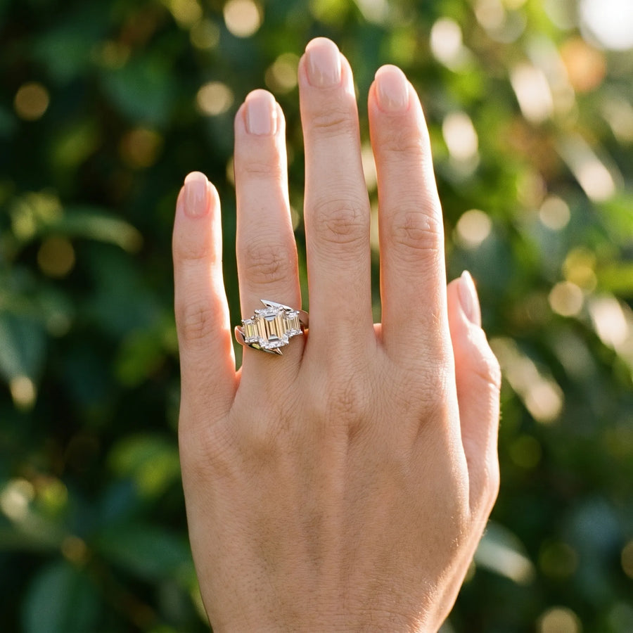 White gold Three-Stone Emerald Cut Tension Band Ring with Four-Prong Setting