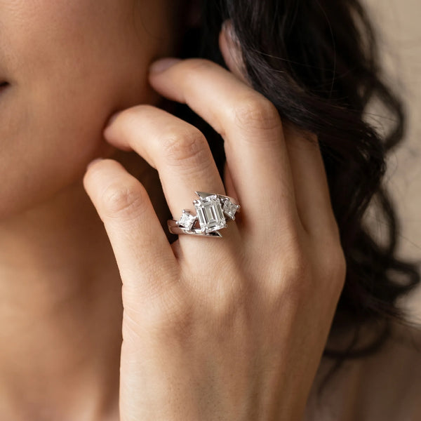 White gold Three-Stone Emerald Cut Tension Band Ring with Four-Prong Setting
