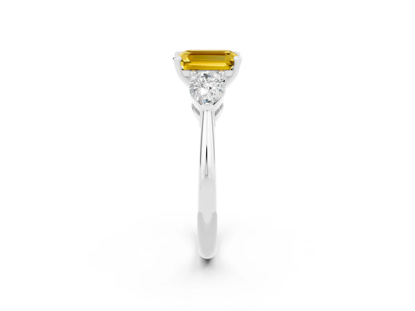 Silver Three-Stone Emerald Cut Yellow Sapphire Ring with Pear Side Stones and Four-Prong Setting