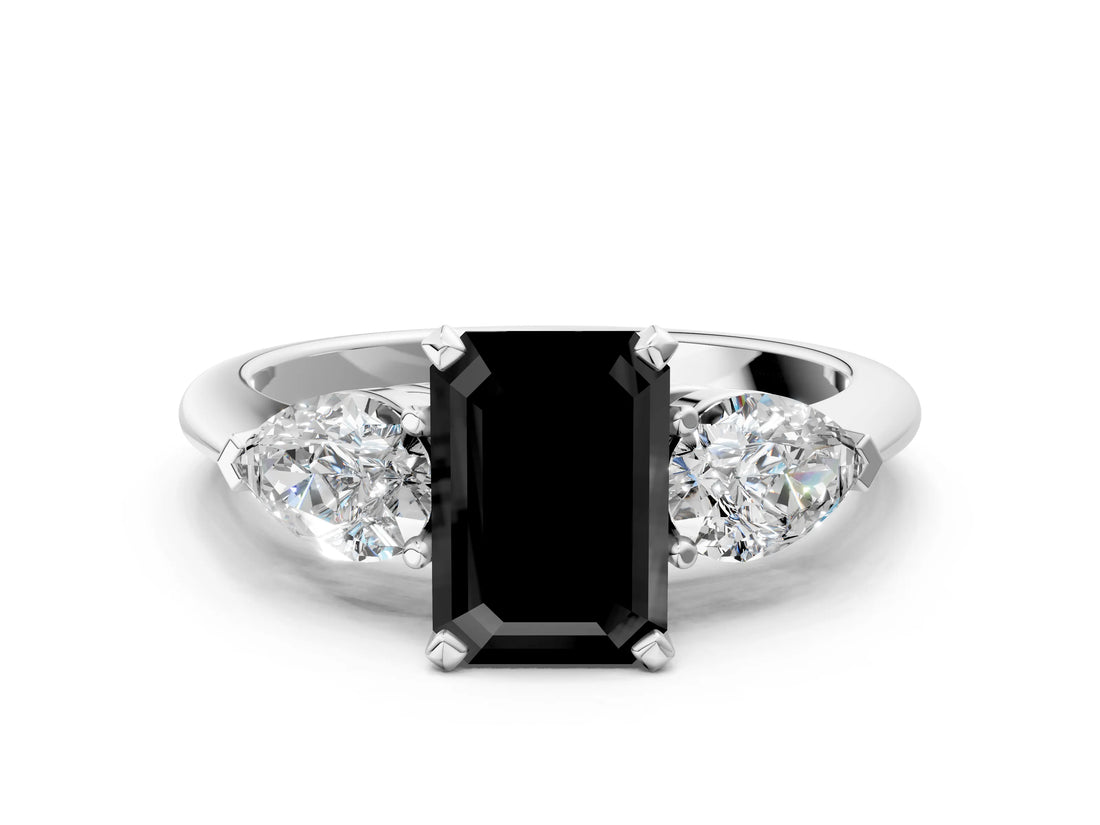 White gold Three-Stone Fancy Black Emerald Cut Diamond Ring with Pear Side Stones and Four-Prong Setting