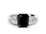 White gold Three-Stone Fancy Black Radiant Cut Diamond Ring with Pear Side Stones and Four-Prong Setting