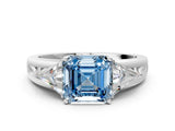 White gold Three-Stone Fancy Blue Asscher Cut Cut Diamond Ring with Trillion Side Stones on a Split Shank Band