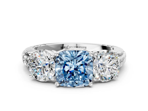 Platinum Three-Stone Fancy Blue Cushion Cut Cut Diamond Ring with Channel-Set Band and Prong Setting