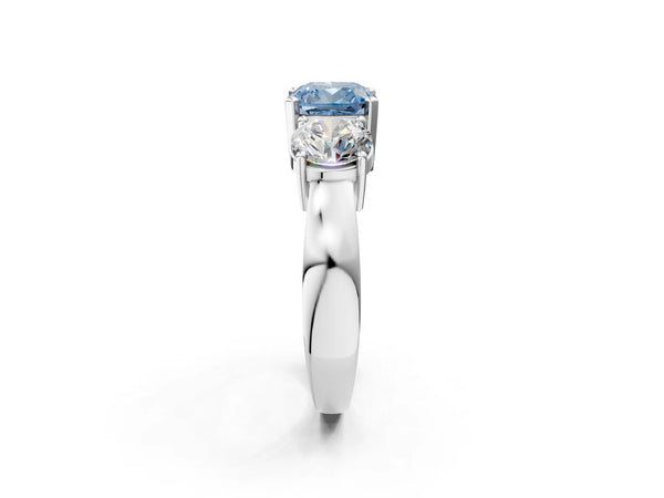 White gold Three-Stone Fancy Blue Cushion Cut Diamond Ring with Round Side Stones, Classic Band, and Four-Prong Setting