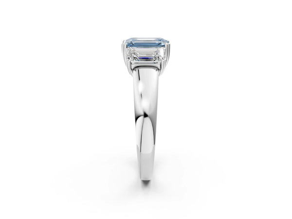 Platinum Three-Stone Fancy Blue Emerald Cut Cut Diamond Ring with Channel Set Band and Four-Prong Setting
