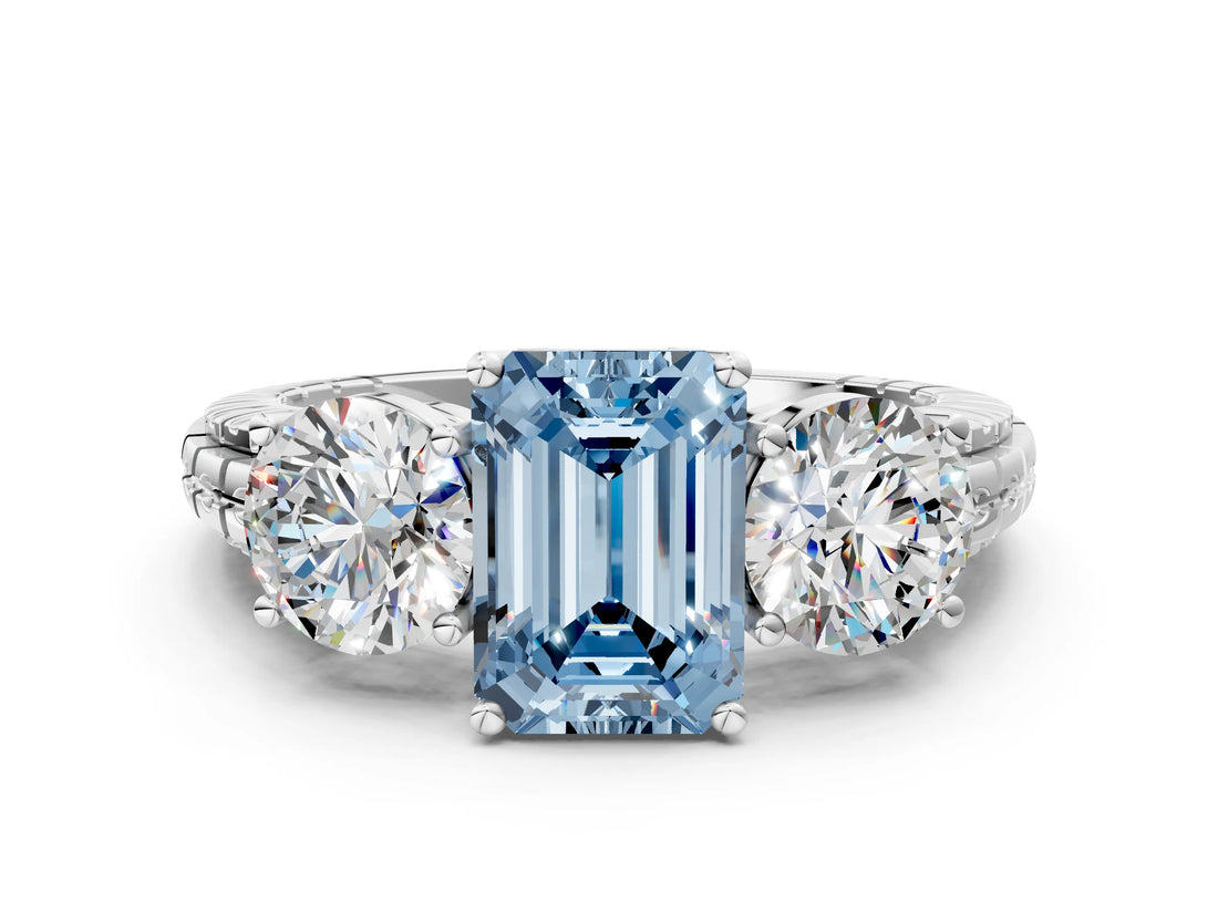 White gold Three-Stone Fancy Blue Emerald Cut Cut Diamond Ring with Channel-Set Band and Prong Setting