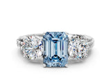 White gold Three-Stone Fancy Blue Emerald Cut Cut Diamond Ring with Channel-Set Band and Prong Setting