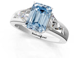 White gold Three-Stone Fancy Blue Emerald Cut Cut Diamond Ring with Trillion Side Stones on a Split Shank Band_13