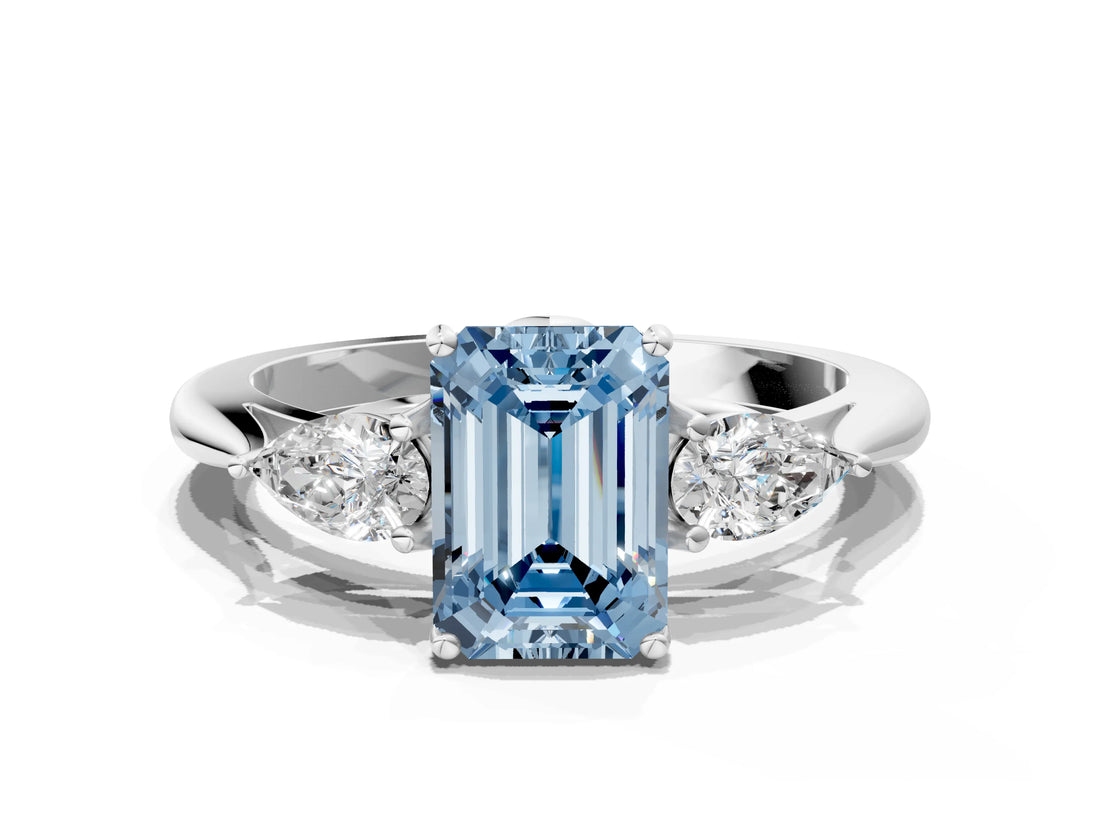 White gold Three-Stone Fancy Blue Emerald Cut Diamond Ring with Pear  Side Stones in Four-Prong Setting_60