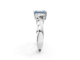 White gold Three-Stone Fancy Blue Emerald Cut Diamond Ring with Round Side Stones, Classic Band, and Four-Prong Setting_2