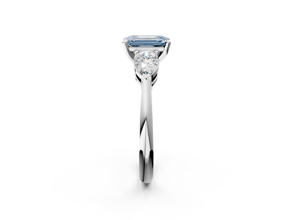 Platinum Three-Stone Fancy Blue Emerald Cut Diamond Ring with Pear Side Stones and Four-Prong Setting