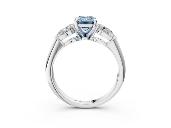 Platinum Three-Stone Fancy Blue Emerald Cut Diamond Ring with Pear Side Stones and Four-Prong Setting