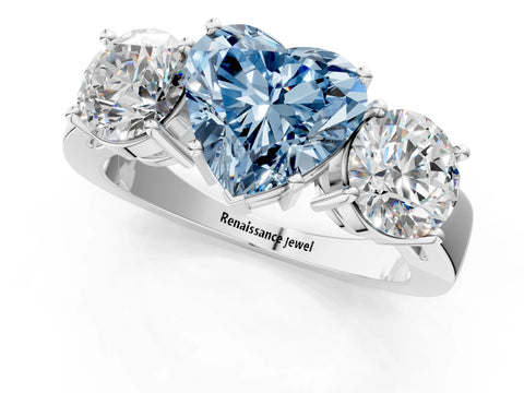 White gold Three-Stone Fancy Blue Heart Cut Diamond Ring with Round Side Stones, Classic Band, and Four-Prong Setting_1