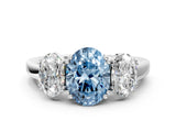White gold Three-Stone Fancy Blue Oval Cut Cut Diamond Ring with Channel Set Band and Four-Prong Setting_24
