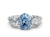 White gold Three-Stone Fancy Blue Oval Cut Cut Diamond Ring with Channel-Set Band and Prong Setting