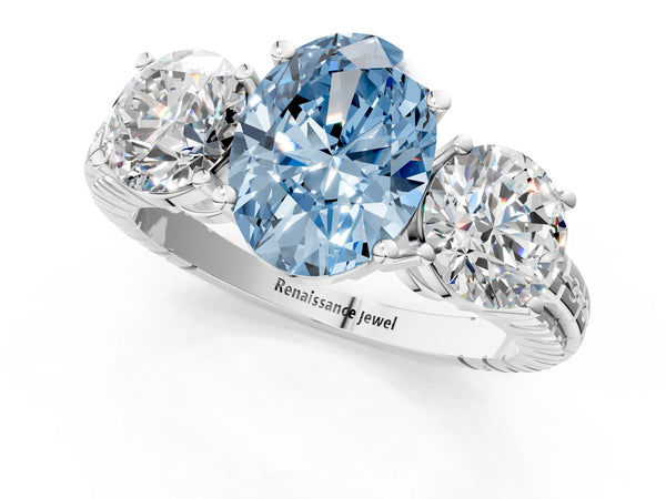 Platinum Three-Stone Fancy Blue Oval Cut Cut Diamond Ring with Channel-Set Band and Prong Setting