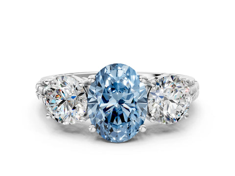 White gold Three-Stone Fancy Blue Oval Cut Cut Diamond Ring with Channel-Set Band and Prong Setting