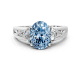 White gold Three-Stone Fancy Blue Oval Cut Cut Diamond Ring with Trillion Side Stones on a Split Shank Band