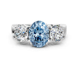 White gold Three-Stone Fancy Blue Oval Cut Diamond Ring with Round Side Stones, Classic Band, and Four-Prong Setting_65