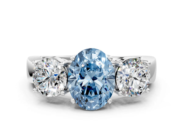 Platinum Three-Stone Fancy Blue Oval Cut Diamond Ring with Round Side Stones, Classic Band, and Four-Prong Setting