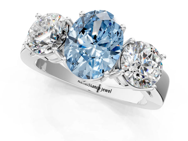 Platinum Three-Stone Fancy Blue Oval Cut Diamond Ring with Round Side Stones, Classic Band, and Four-Prong Setting