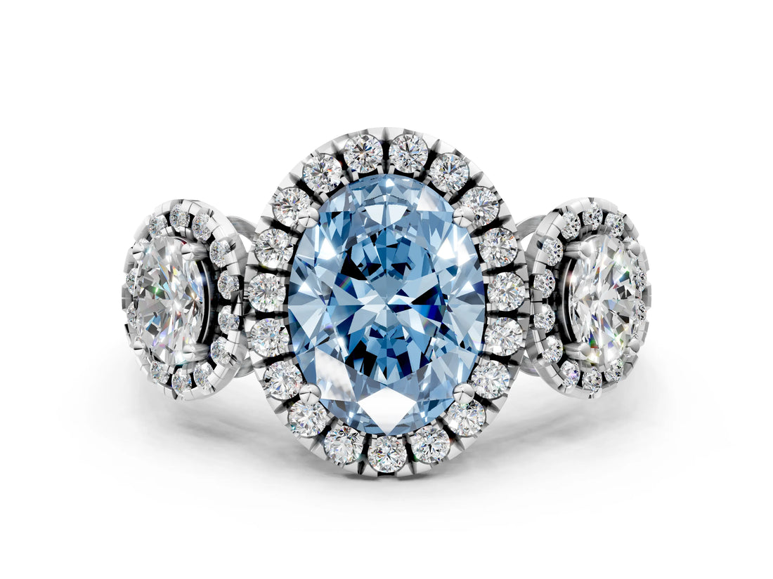 White gold Three-Stone Fancy Blue Oval Cut Halo Diamond Ring with Pave Band and Four-Prong Setting
