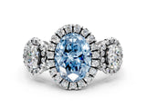 White gold Three-Stone Fancy Blue Oval Cut Halo Diamond Ring with Pave Band and Four-Prong Setting