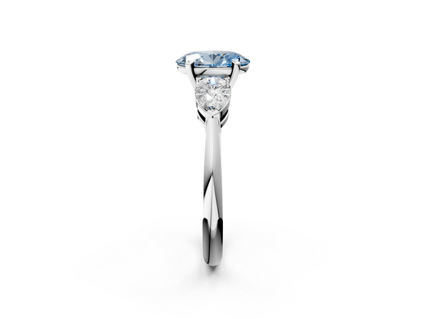 Platinum Three-Stone Fancy Blue Oval Cut Diamond Ring with Pear Side Stones and Four-Prong Setting