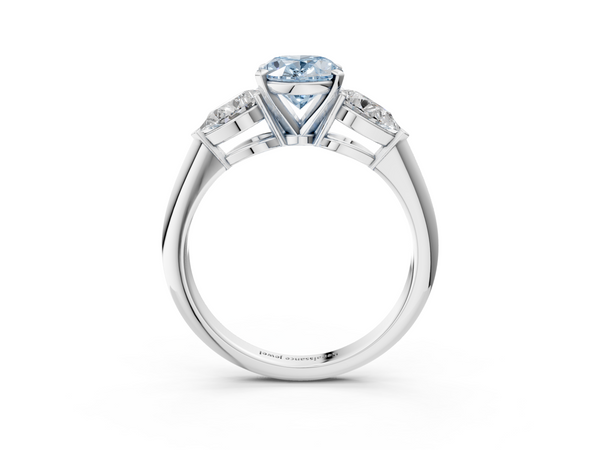 Platinum Three-Stone Fancy Blue Oval Cut Diamond Ring with Pear Side Stones and Four-Prong Setting