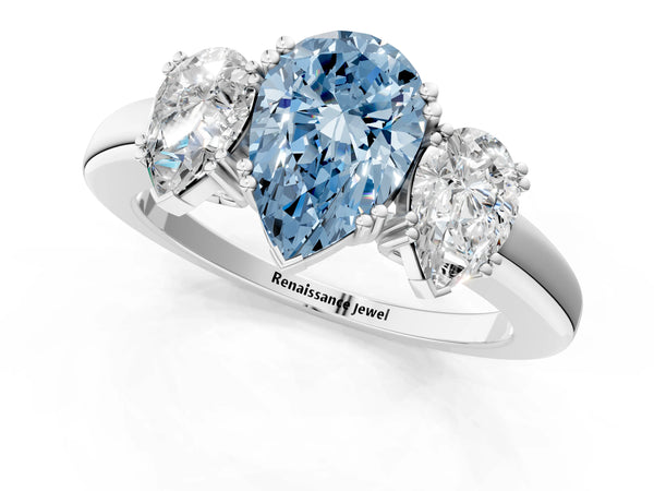 White gold Three-Stone Fancy Blue Pear Cut Cut Diamond Ring with Channel Set Band and Four-Prong Setting
