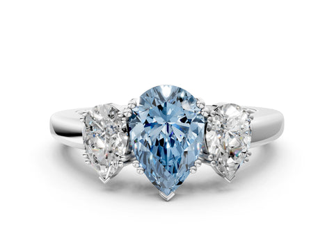 White gold Three-Stone Fancy Blue Pear Cut Cut Diamond Ring with Channel Set Band and Four-Prong Setting