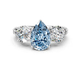 White gold Three-Stone Fancy Blue Pear Cut Cut Diamond Ring with Channel-Set Band and Prong Setting